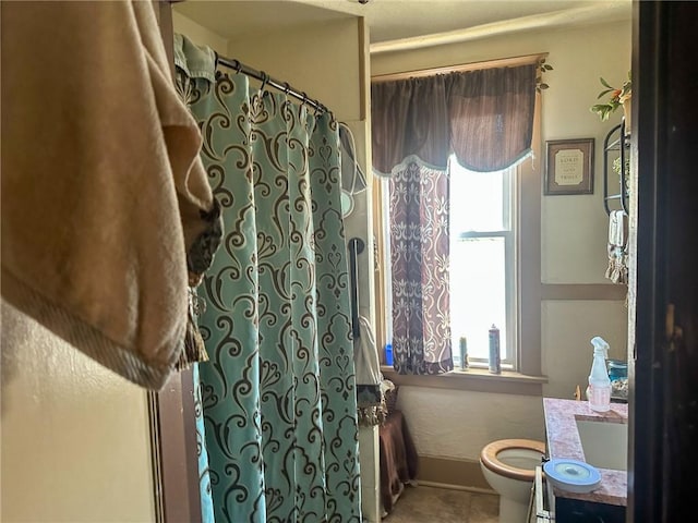 bathroom with vanity, toilet, and a shower with shower curtain