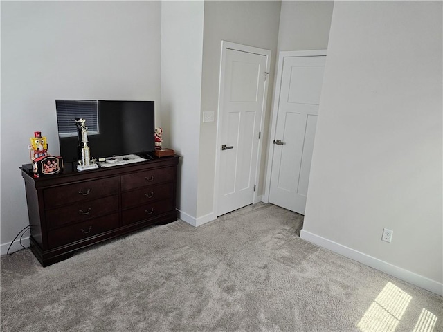 bedroom with light colored carpet