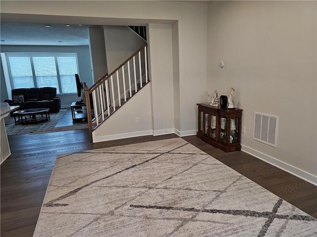 foyer entrance with dark hardwood / wood-style flooring