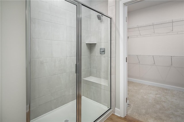 bathroom with a shower with shower door