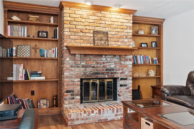 living room featuring hardwood / wood-style flooring and a fireplace