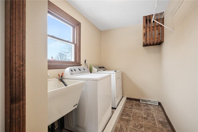 laundry room featuring sink and independent washer and dryer