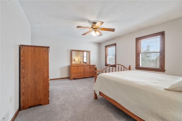 bedroom with light colored carpet and ceiling fan