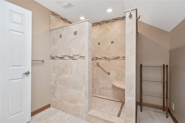 bathroom with a tile shower