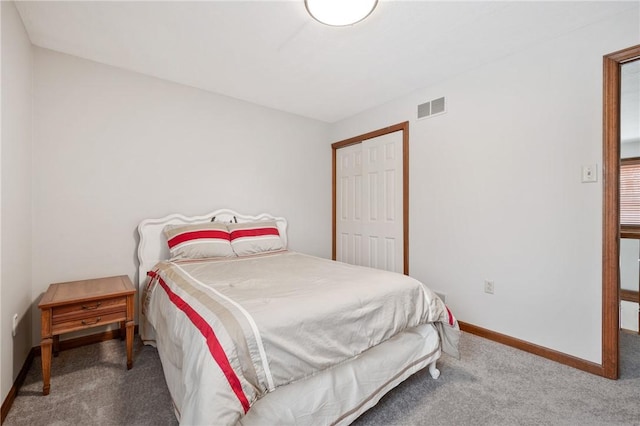 carpeted bedroom with a closet