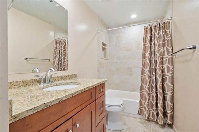 full bathroom featuring shower / tub combo with curtain, vanity, and toilet