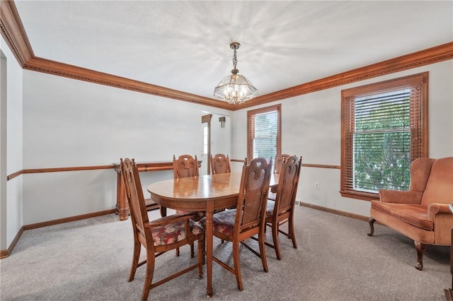 dining space featuring light carpet, crown molding, and an inviting chandelier