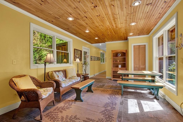 sitting room featuring ornamental molding and wooden ceiling