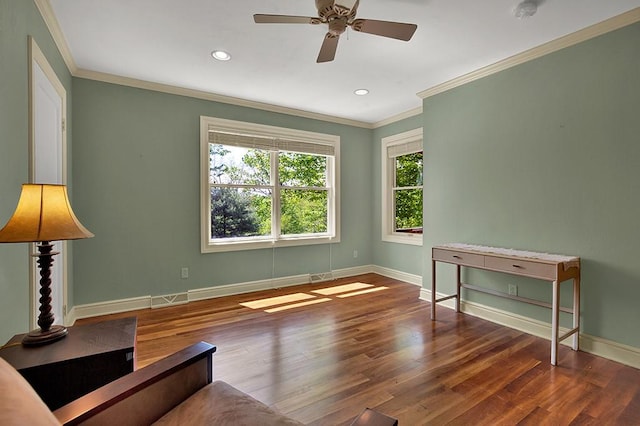 interior space with crown molding, ceiling fan, and dark hardwood / wood-style flooring