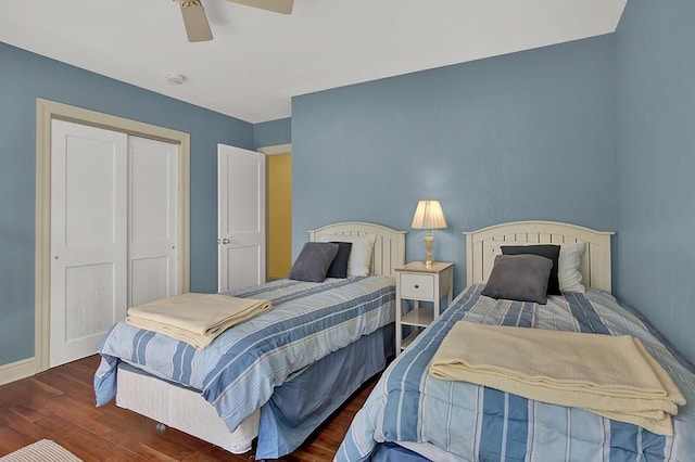 bedroom featuring dark hardwood / wood-style flooring, a closet, and ceiling fan