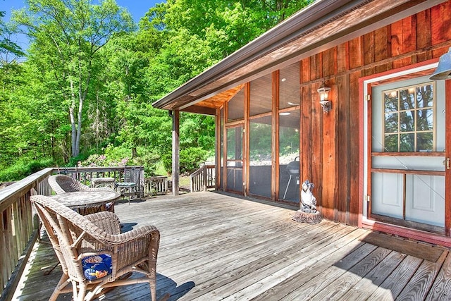 wooden terrace with a sunroom