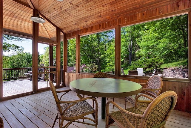 254 Light Ln, Cook Twp, PA 15658 - sunroom / solarium featuring outdoor dining area, a deck, wooden ceiling, healthy amount of natural light, and wood walls