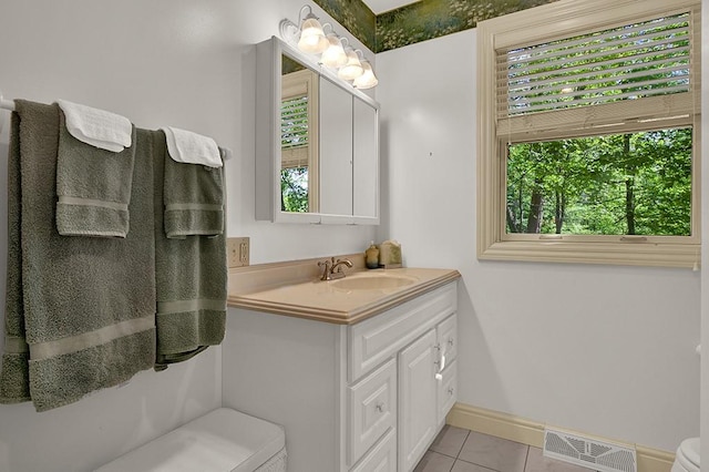 bathroom with tile patterned floors, toilet, and vanity