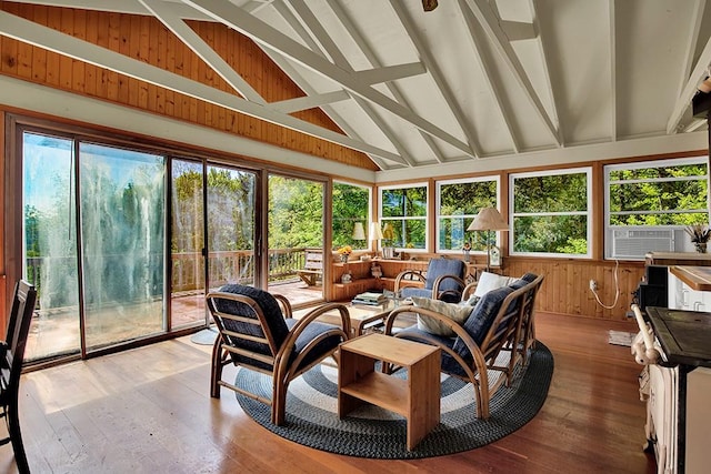 sunroom / solarium with vaulted ceiling with beams