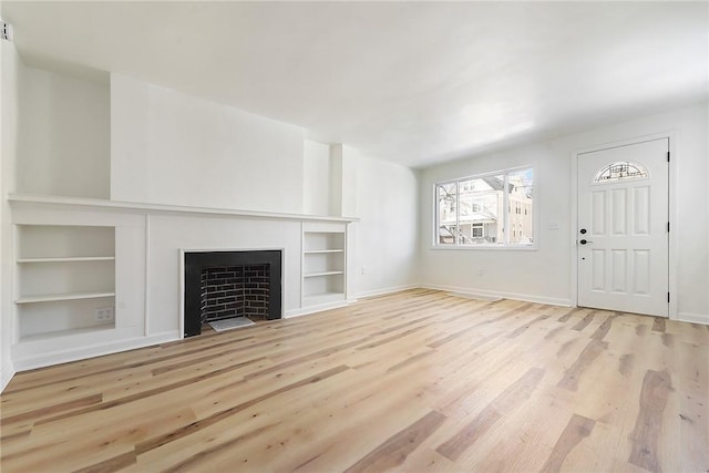 unfurnished living room with light hardwood / wood-style flooring