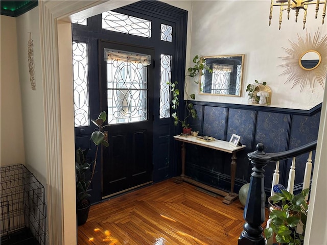 foyer featuring parquet floors