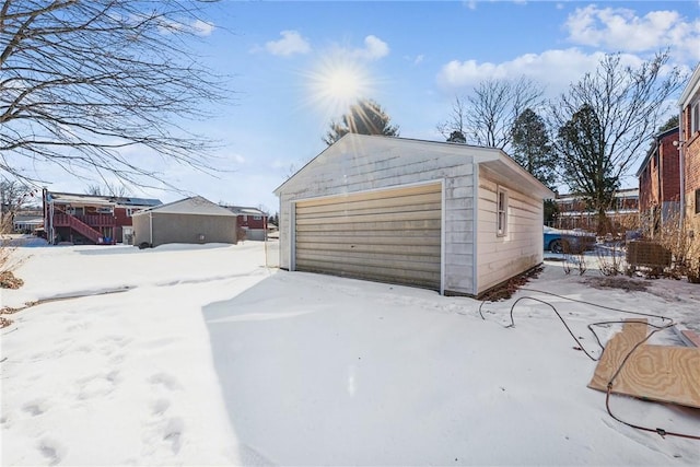 view of snow covered garage