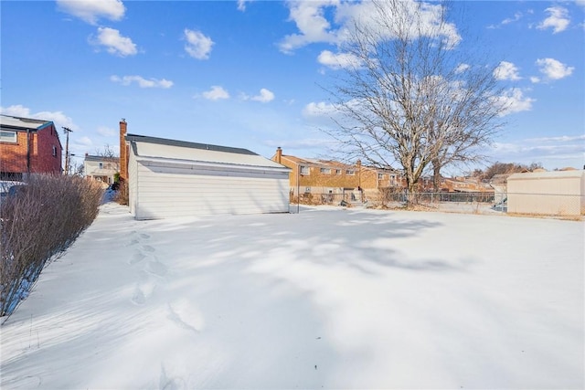 view of yard layered in snow