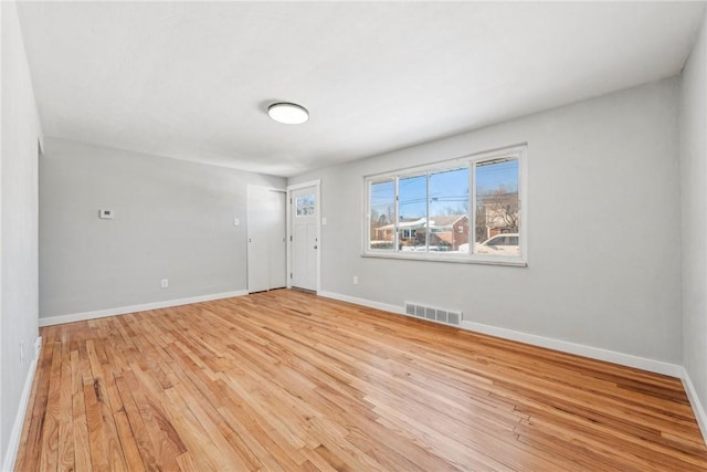 unfurnished room with light hardwood / wood-style floors