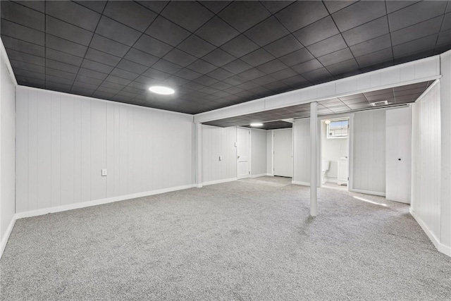 basement featuring carpet flooring