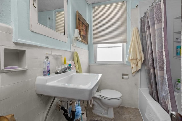 full bathroom featuring shower / tub combo, sink, tile patterned flooring, and toilet