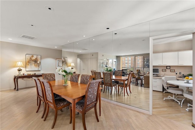 dining room featuring light hardwood / wood-style flooring