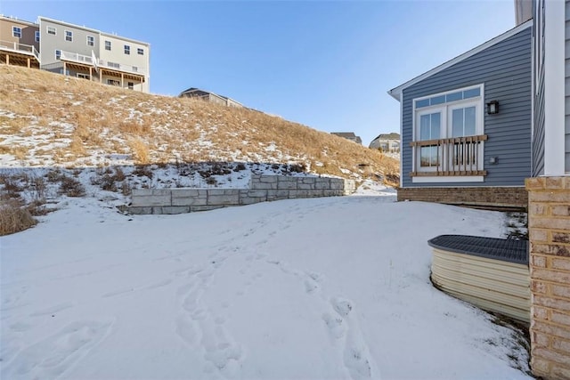 view of yard layered in snow