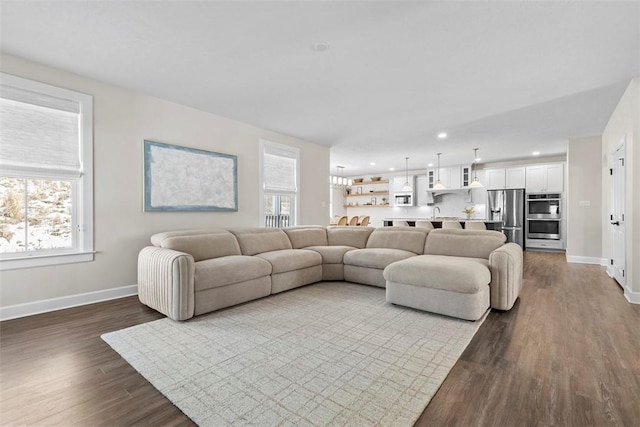 living room with hardwood / wood-style flooring and a healthy amount of sunlight