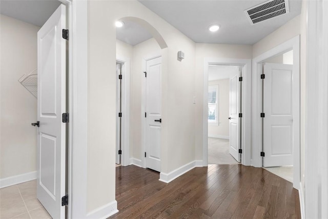 corridor with wood-type flooring