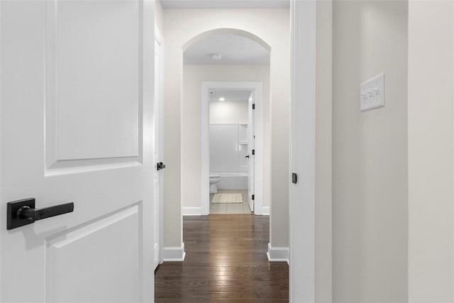 corridor with dark wood-type flooring