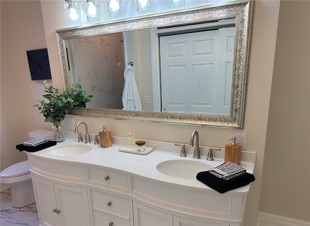 bathroom with vanity and toilet