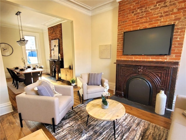 living room featuring ornamental molding and light hardwood / wood-style floors