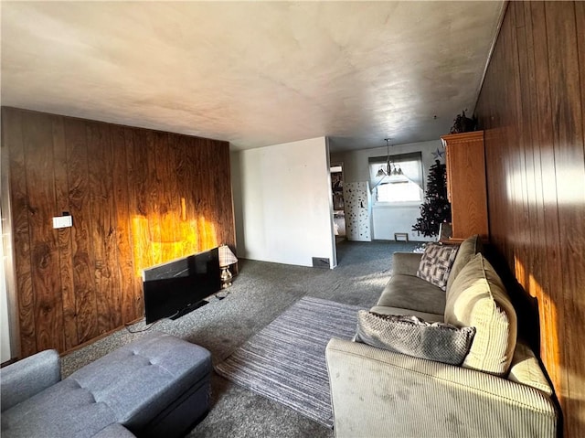 living room with carpet flooring and wood walls