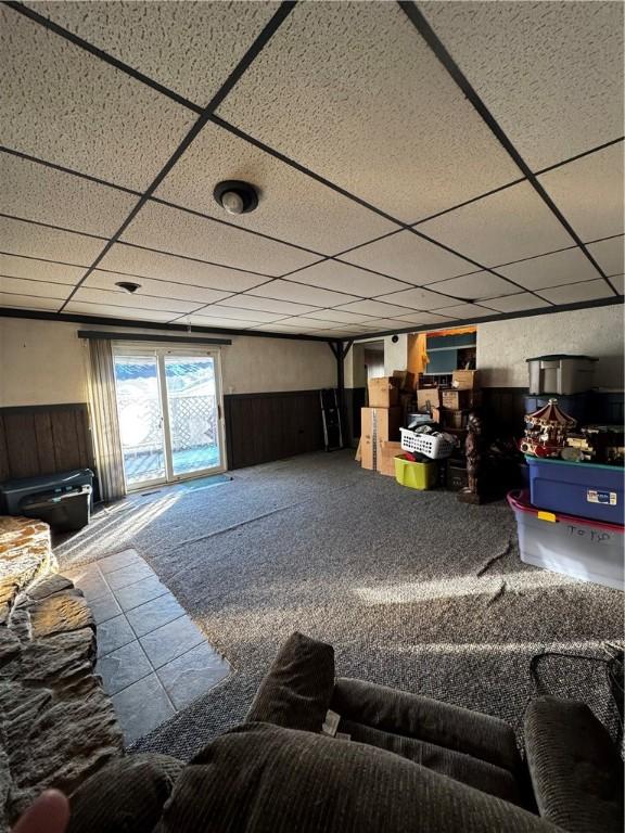 living room with a paneled ceiling