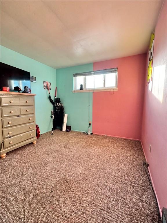 unfurnished bedroom with carpet floors