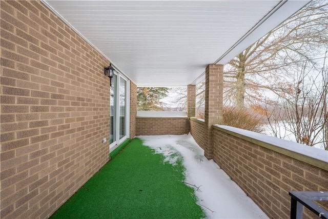 view of yard layered in snow