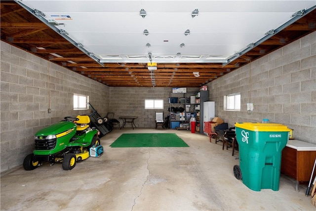 garage with concrete block wall