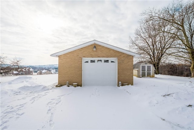 view of snow covered garage