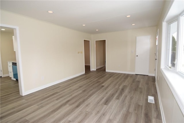 unfurnished room with wood-type flooring