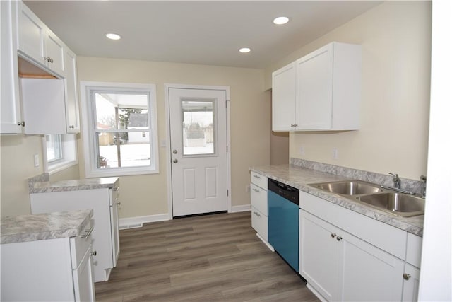 kitchen featuring sink, stainless steel dishwasher, dark hardwood / wood-style floors, and white cabinets