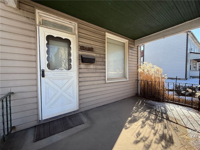 property entrance featuring covered porch