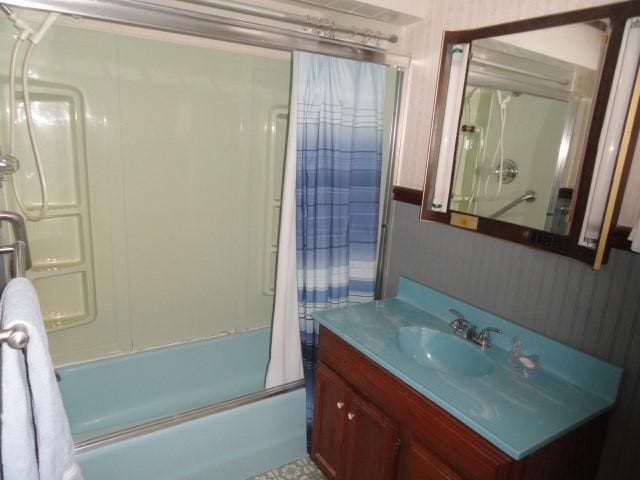 full bathroom with bath / shower combo with glass door and vanity