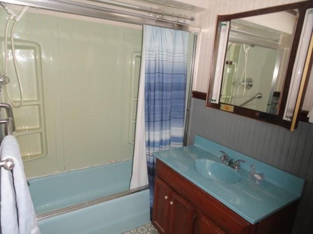full bath with vanity and shower / bath combination with glass door