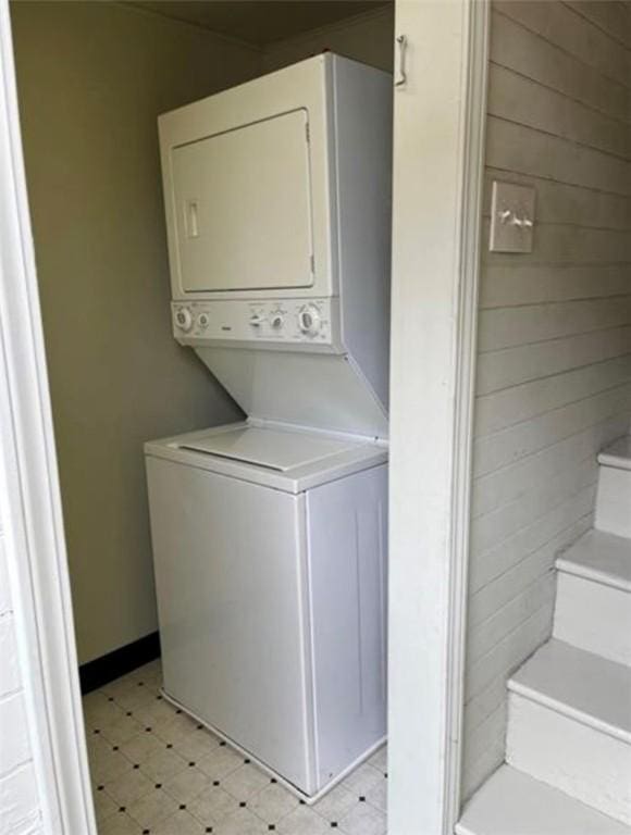 washroom with stacked washer and dryer