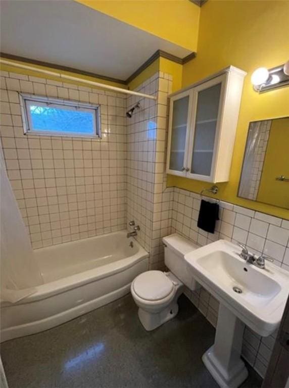 bathroom with tile walls, shower / tub combo, backsplash, and toilet