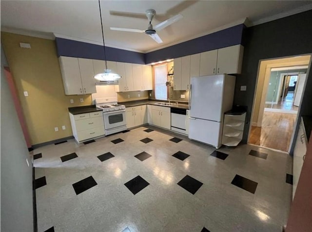 kitchen with pendant lighting, sink, white cabinets, ornamental molding, and white appliances