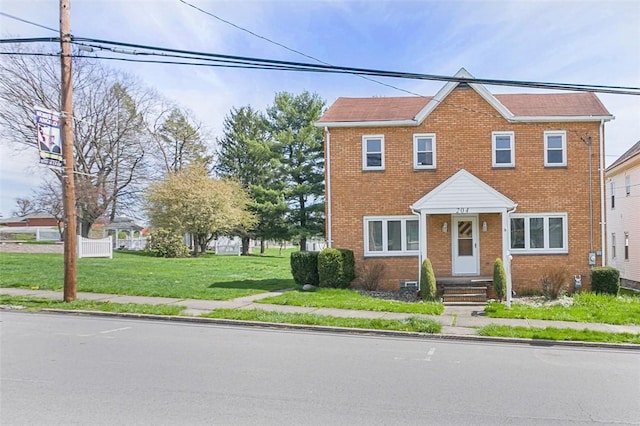 204 Liberty St, Perryopolis, PA 15473 - view of front of house featuring brick siding and a front lawn