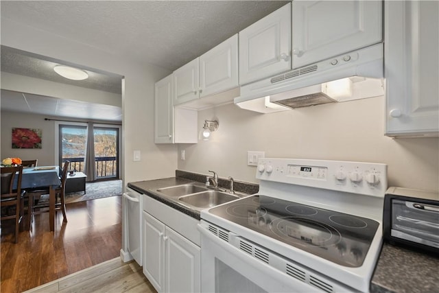 kitchen featuring sink, white electric range, stainless steel dishwasher, and white cabinets