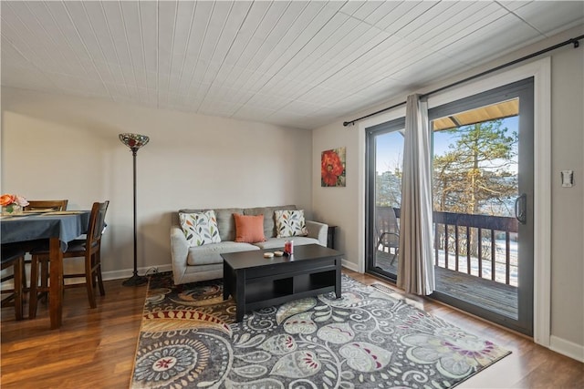 living room featuring wood ceiling and wood-type flooring