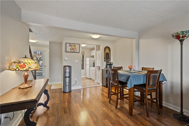 dining area with hardwood / wood-style floors